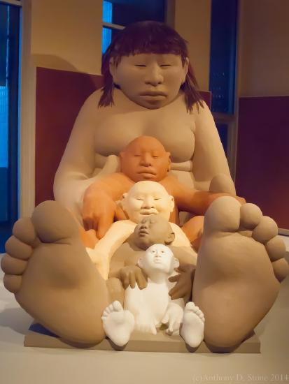 Five figures nestled in front of each other