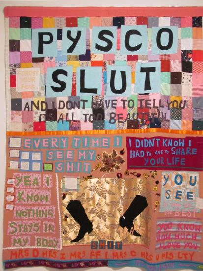 A colorful poster of cut out letters glued down in patterns