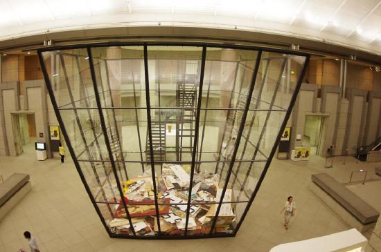 Big glass box with trash at the bottom