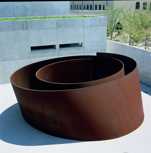 a large circular sculpture outside on concrete
