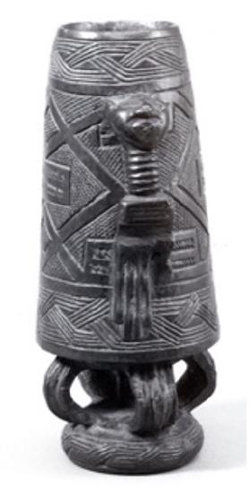 a wooden drum carved with a figure and a hand 