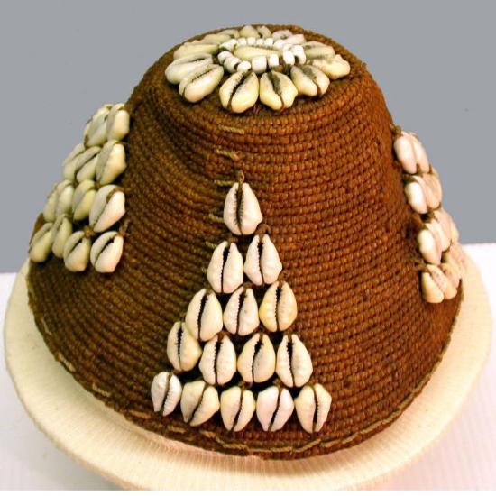 a woven hat with shells in triangle patterns
