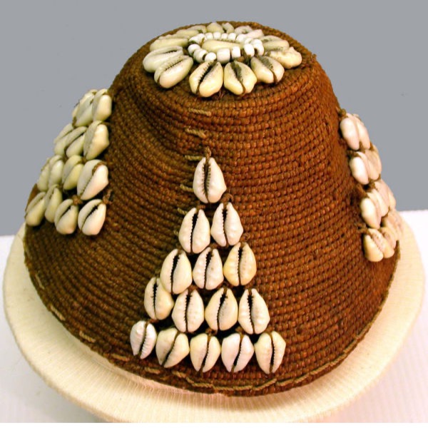a woven hat with shells in triangle patterns