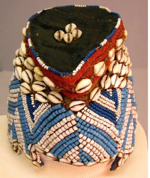 Ornate shelled and beaded hat with fabric of colors