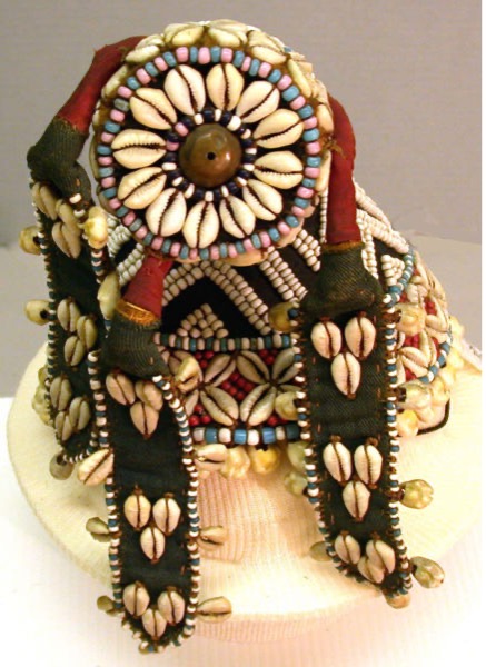 Ornate shelled and beaded hat with fabric of colors