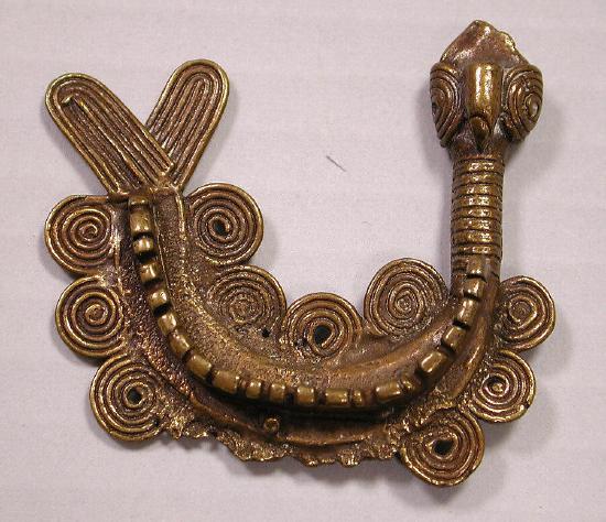 a u shape gold mudfish with curlicues representing water