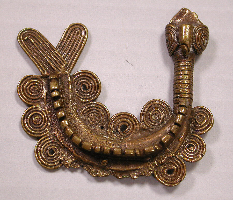 a u shape gold mudfish with curlicues representing water
