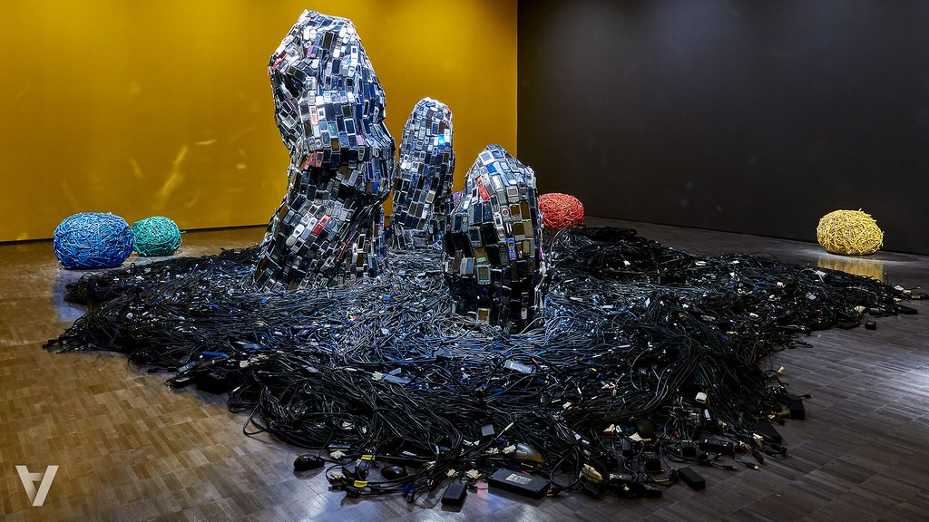 cellphones and computer cables in a rock sculpture 
