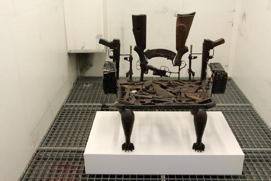 a throne made out of used gun parts