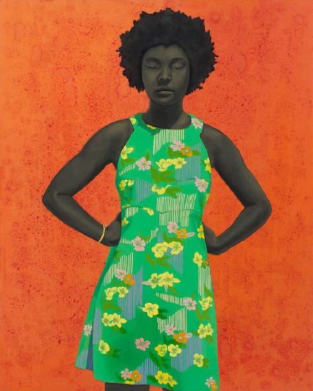 A standing woman in a green floral dress against an orange background