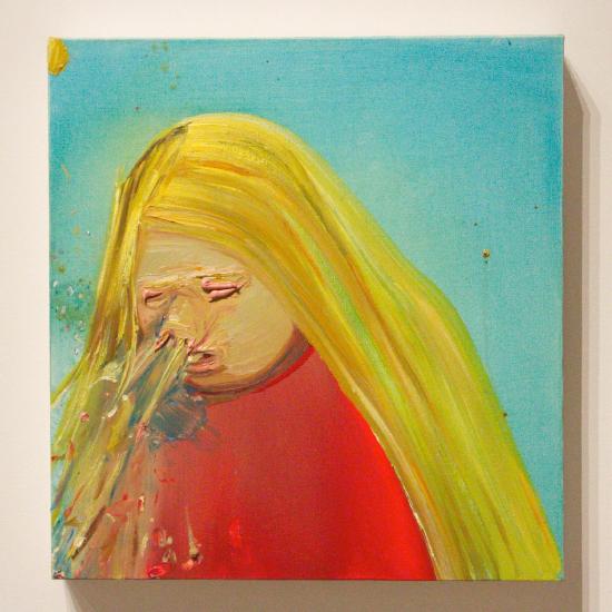 a woman wearing a red shirt is sneezing