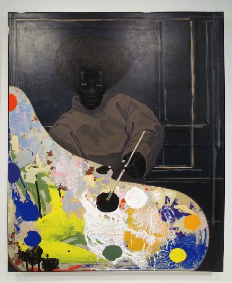 an artist with a very large palette with colorful paint