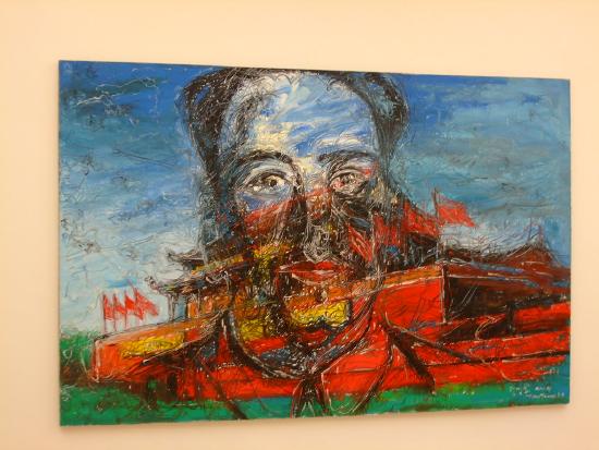 a portrait of a man on top of a red temple