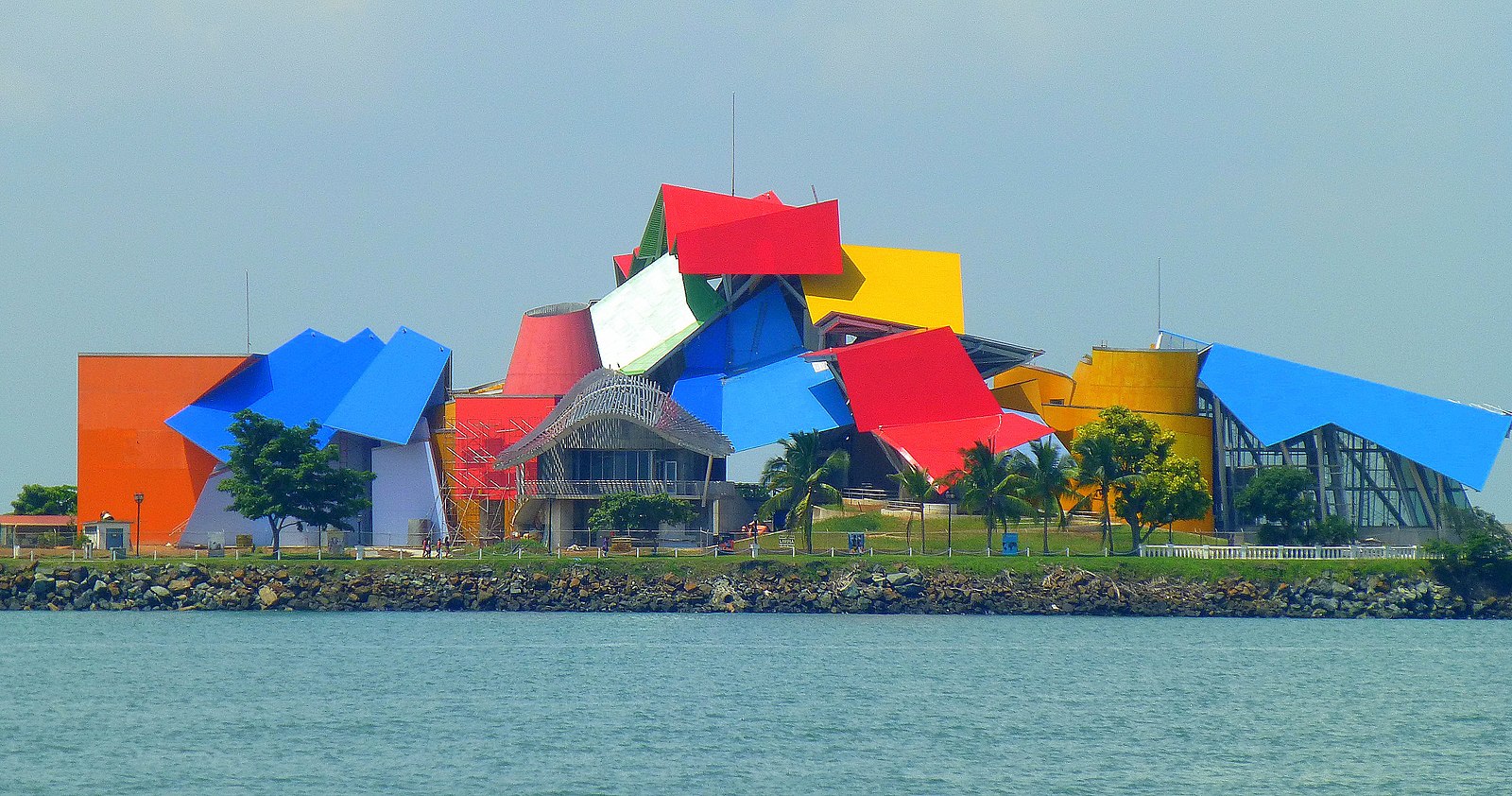 a large colorful building with steel roofs going in each way