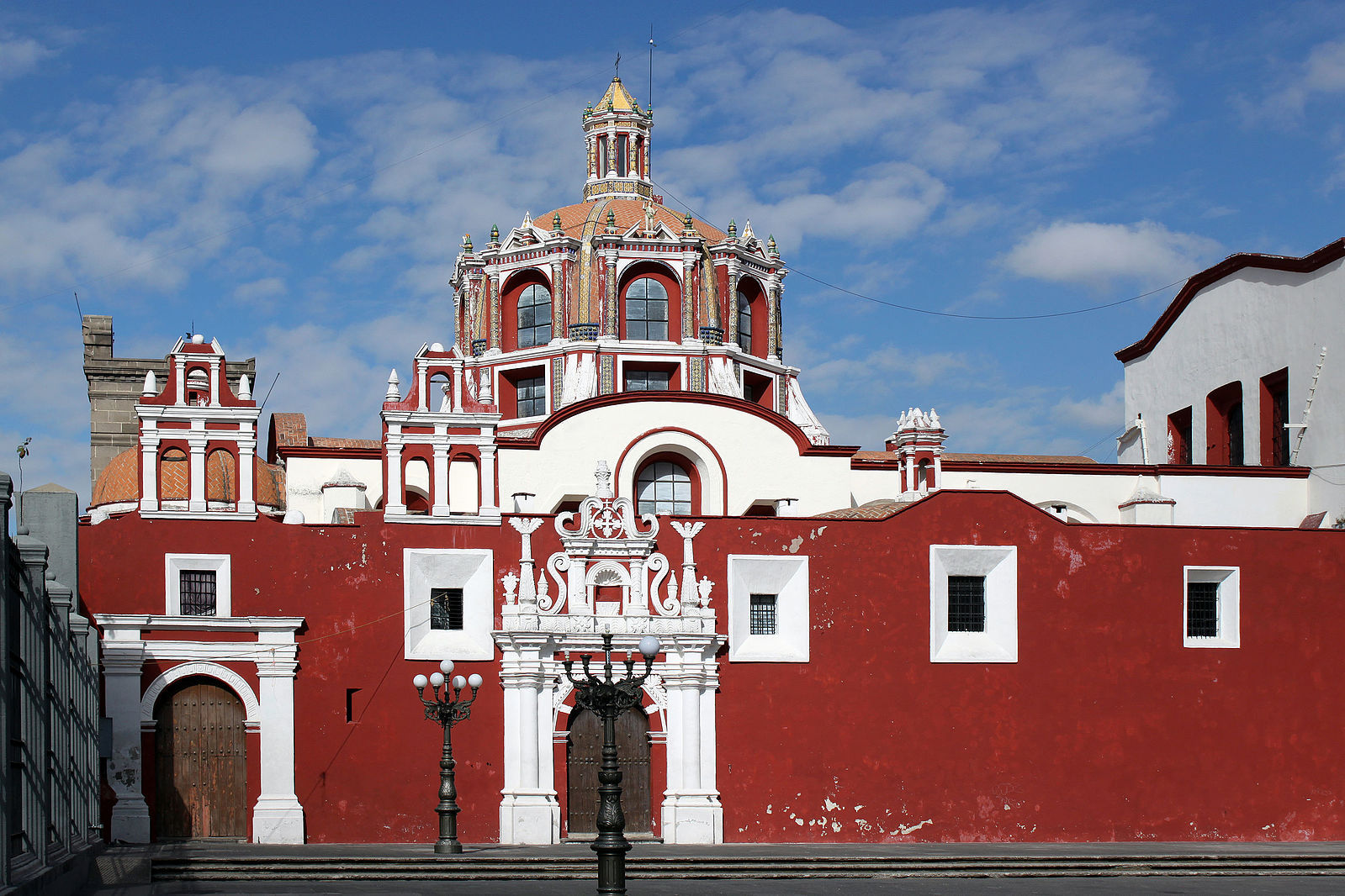 red and white building with an elaborate dome