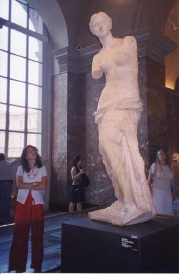 A woman looking at a sculpture in a Museum
