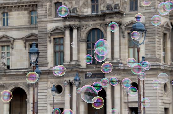 Soap bubbles floating through Paris