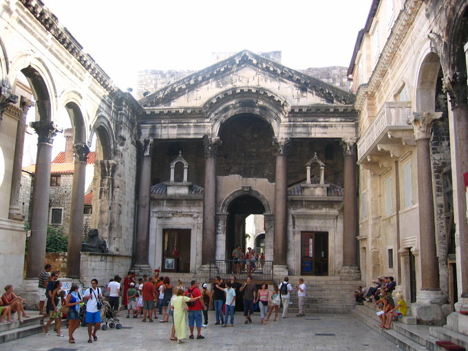 The Peristyle at Diocletian’s Palace: The arcuated pediment is a rare feature in Roman architecture. Resting on four Composite columns, the pediment contains a round arch that rises into its base toward its apex.