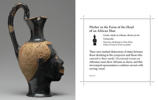 Pitcher (Oinochoe) in the Form of the Head of an African, with the label that accompanies it in Athenian Vases (Gallery 103) at the Getty Villa.