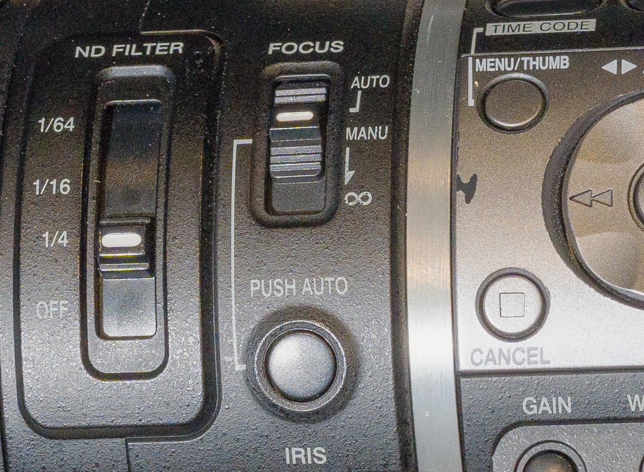 Focus functions on the side of a video camera.