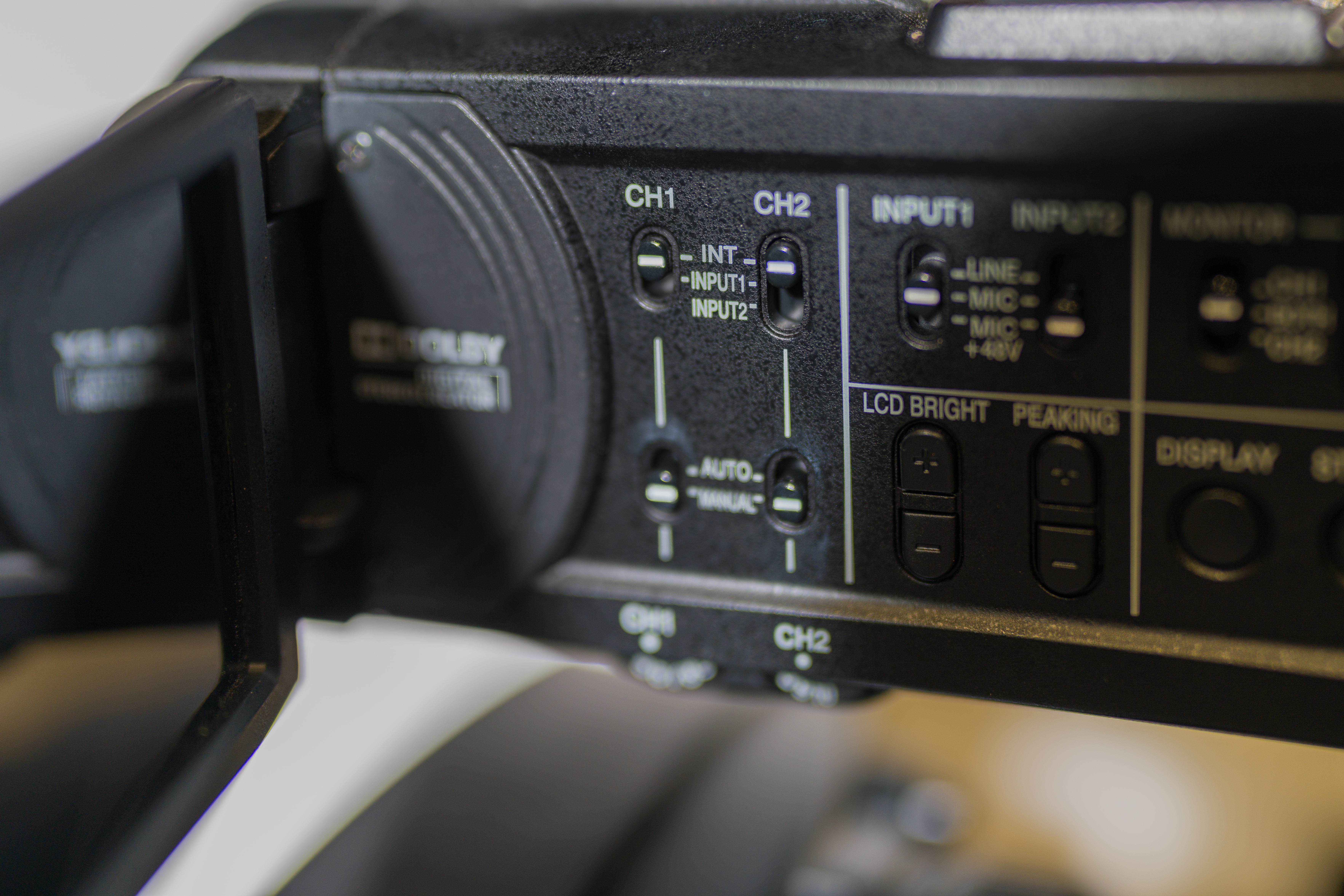 Side view of video camera with Channel controls that can be set to INT, Input 1, or Input 2.