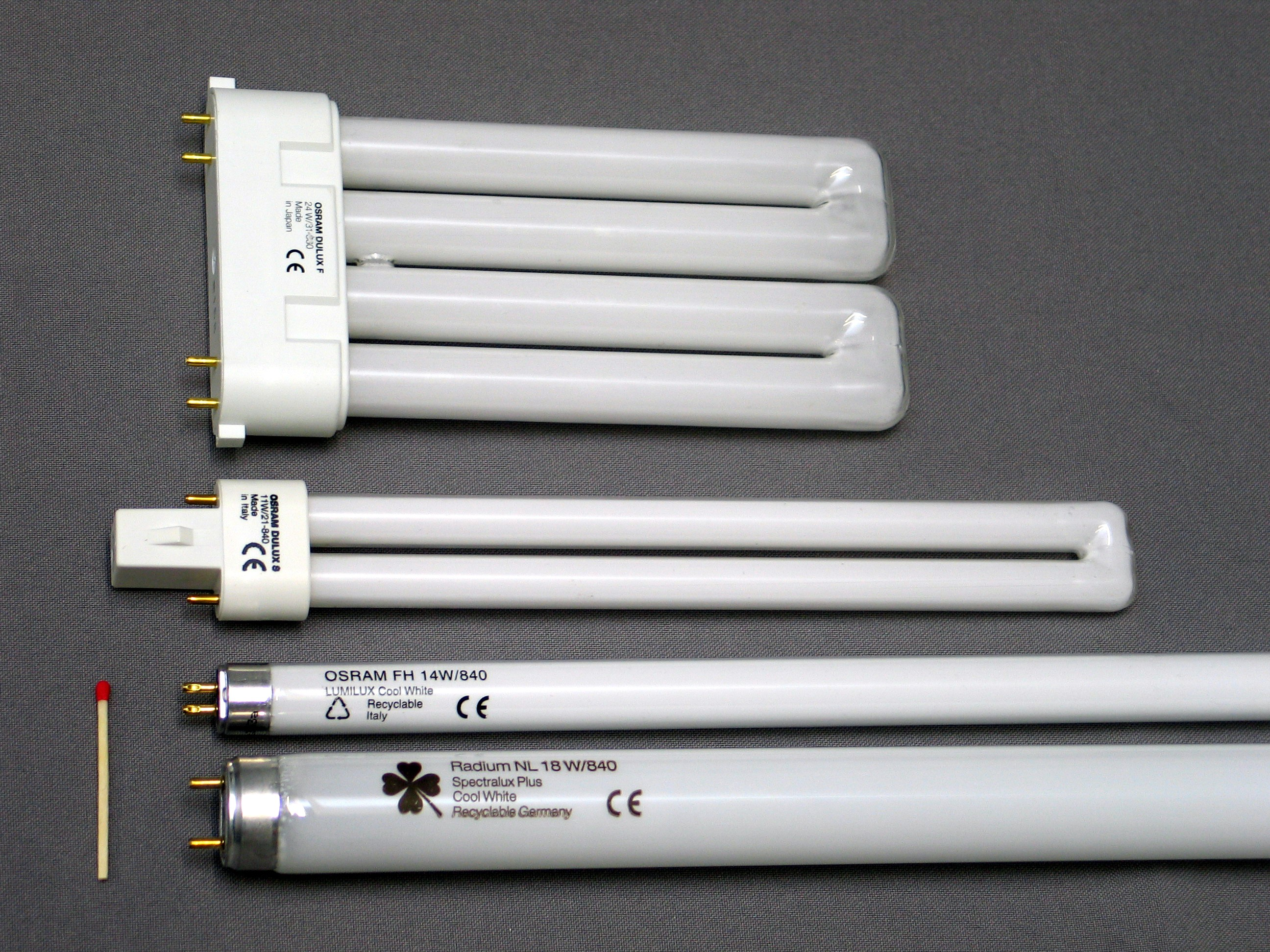 Two tube lights one thicker than the other. Two bulbs are rectangle shaped, instead of long tubes. 