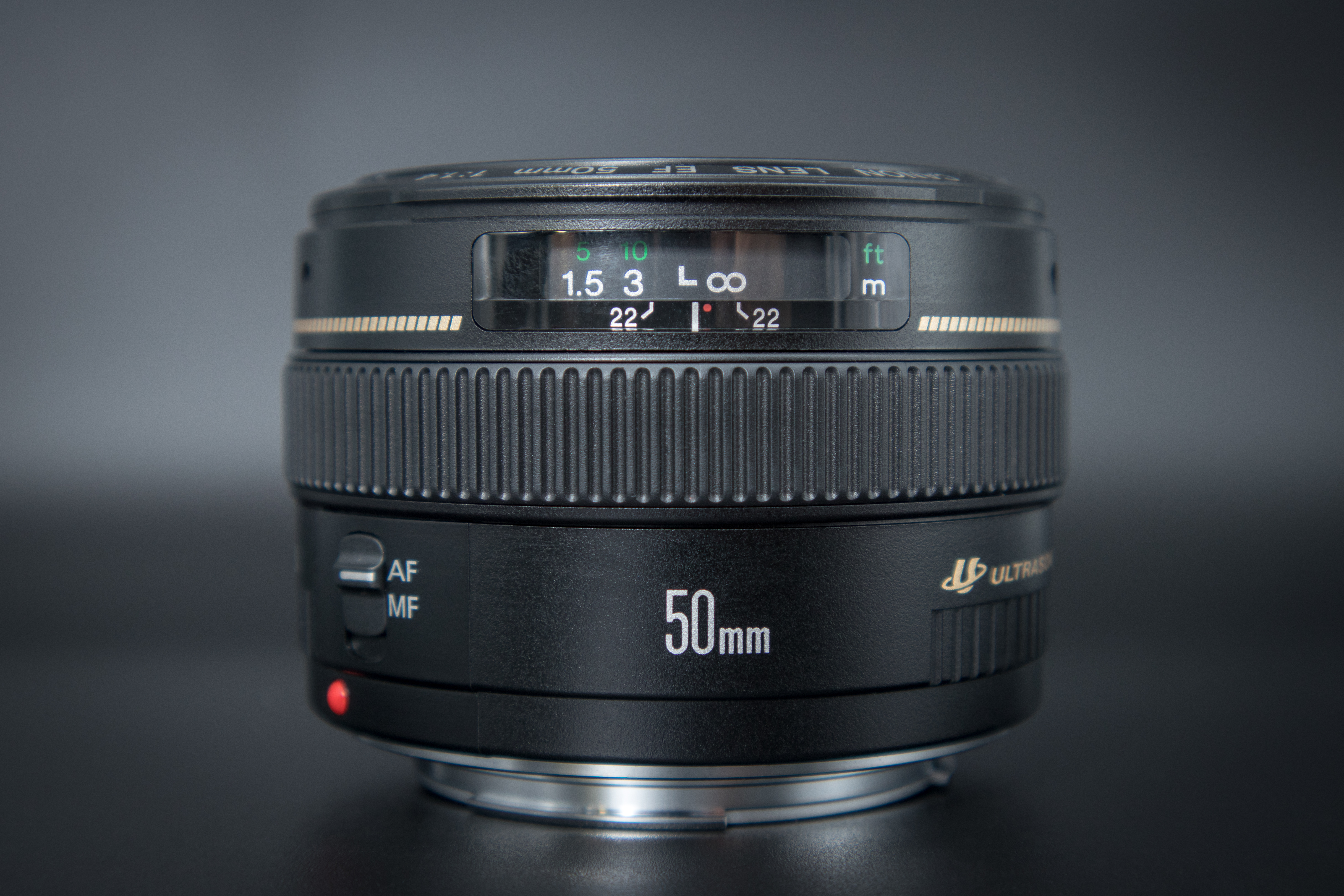 A 50mm prime lens stood up on its end.