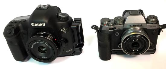 A DSLR next to a Mirrorless camera and the DSLR is wider and taller.
