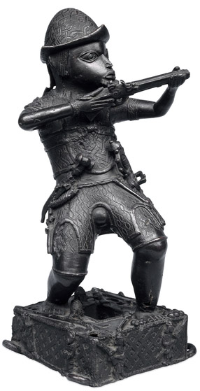 Brass figure of a Portuguese soldier holding a musket, 17th century C.E., Benin, Nigeria © Trustees of the British Museum
