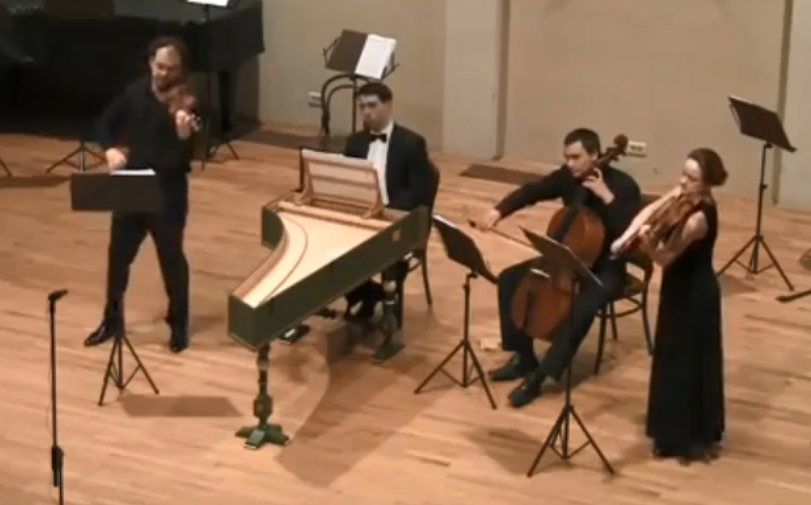 Picture of members of a trio sonata including two violinists, a cellist, and harpsichord player
