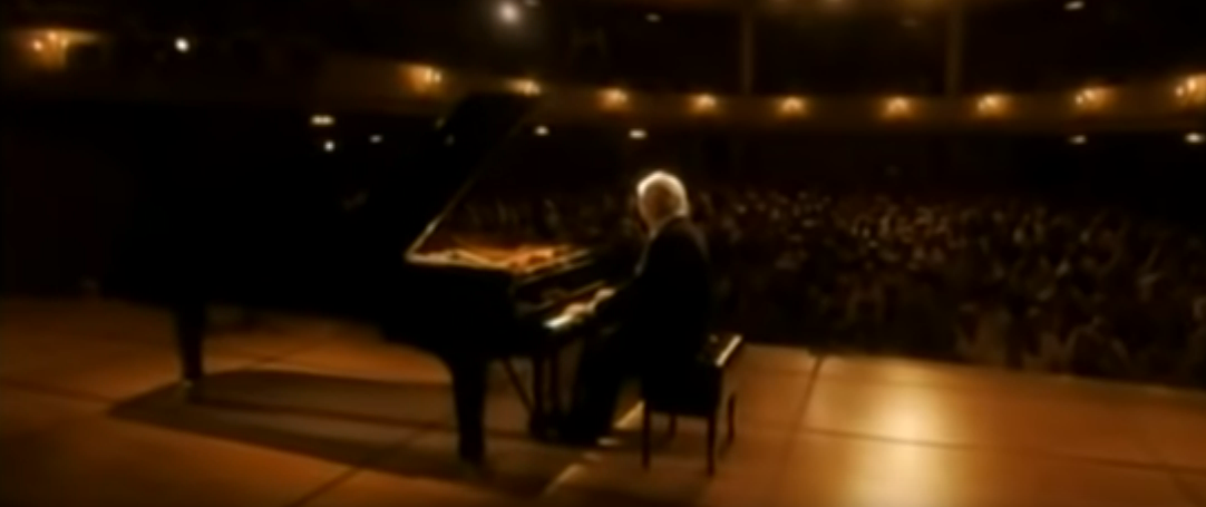 Daniel Barenboim performs a solo piano sonata on stage