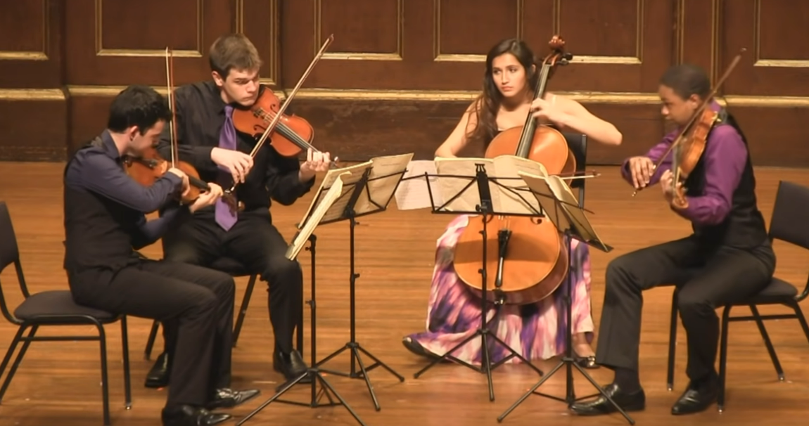 A picture of a string quartet performing live