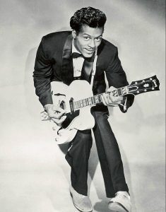 Chuck Berry holding a guitar.