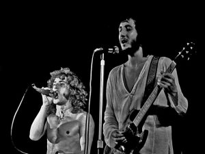 A black and white photo of The Who performing live (1972)
