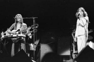 Black and white photo of two members from Yes performing live