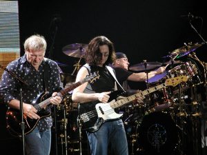 Color photo of Rush performing live