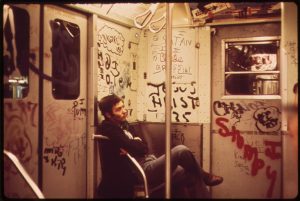 Color photo of graffiti in a New York subway car