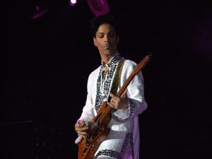 Photographic image of Prince performing.