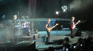 Color photo of the Police performing live.