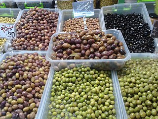 Olive varieties at a stall in a food market in Ankara.