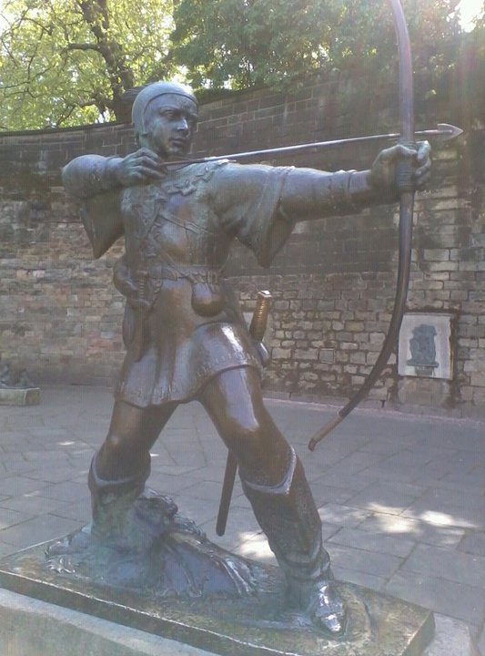 Bronze statue of Robin Hood with a bow and arrow